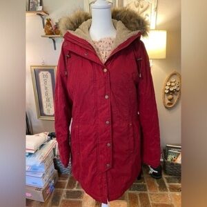 a.n.a red quilted parka with fur trimmed hood.